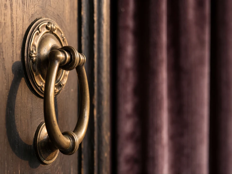 Vintage brass door knocker on a dark wooden door with warm golden light, representing reporting and blocking tools for safe online dating